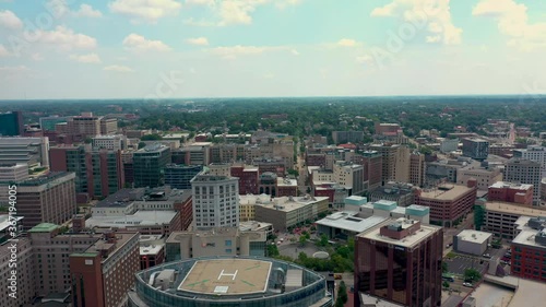 Scenic aerial view of downtown Grand Rapids Michigan including sky scrappers and crane 02