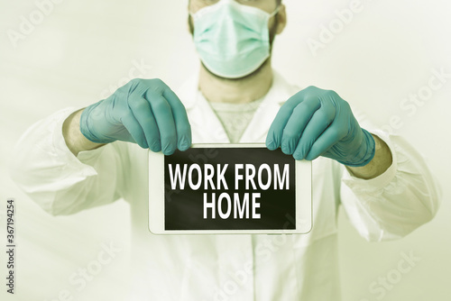 Text sign showing Work From Home. Business photo text communicating with the company mainly from home flexibly Laboratory Technician Featuring Empty Sticker Paper Accessories Smartphone