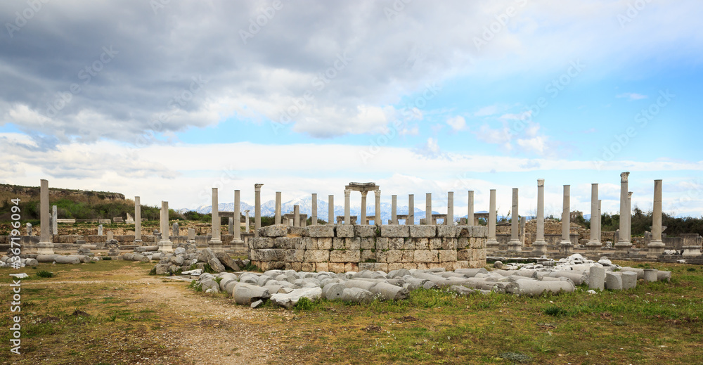 Panoromic view of ancient ruins and columns of historical buildins from Roman Empire in Antalya, Turkey.