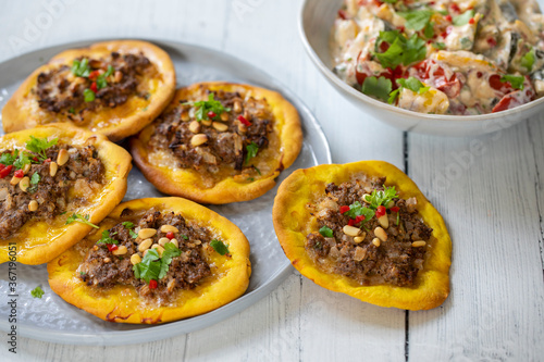 Open meat pies with lamb mince and pistachio nuts
