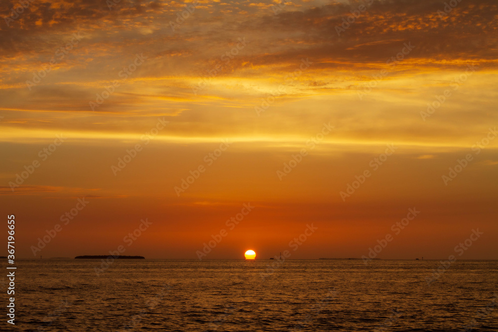sun sinking below the horizon in key west sun sinking below the horizon in key west