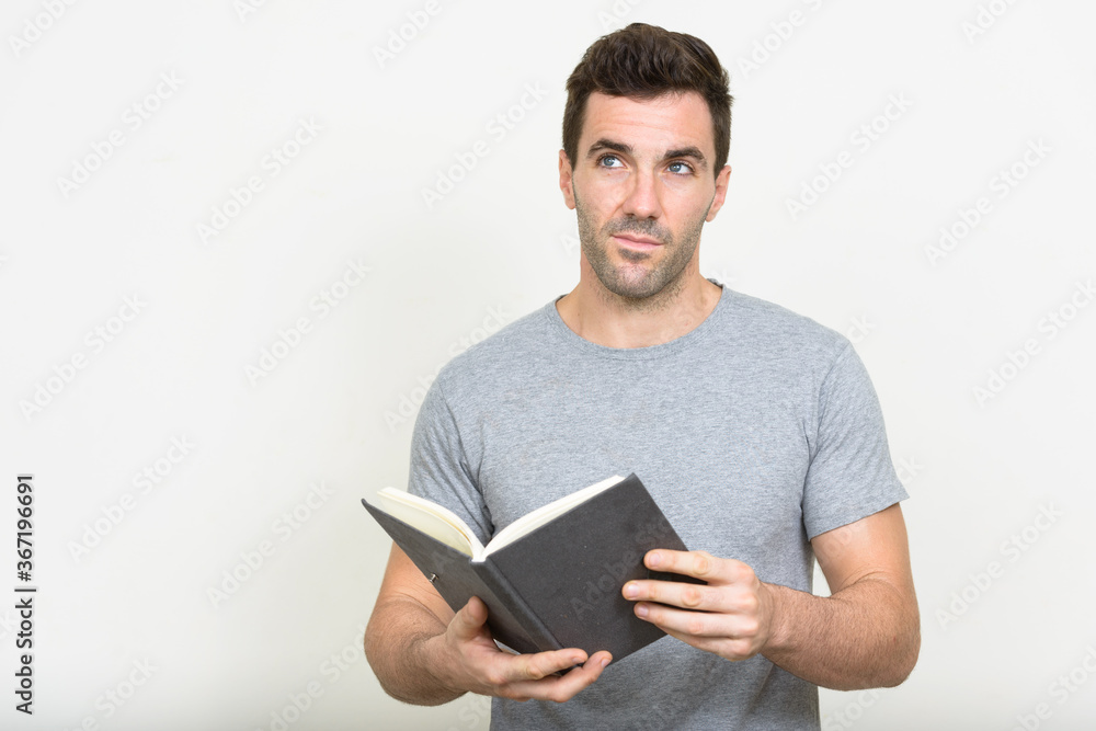 Portrait of handsome Hispanic man with beard stubble Portrait of handsome Hispanic man with beard stubble