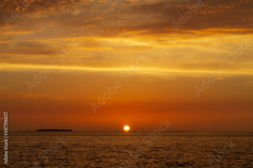 sun touching the horizon in key west © TS Images