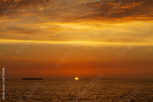 sun sinking below the horizon in key west © TS Images