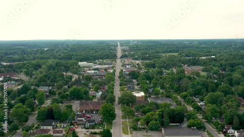 Scenic aerial flyover of a small town America on a quiet morning with empty streets 06