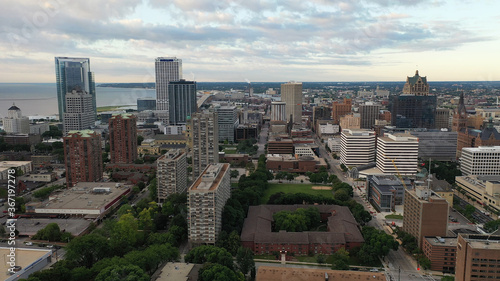 Aerial view of the Milwaukee skyline from the north side of the city, Michigan lake shoreline. Cloudy morning, summertime.