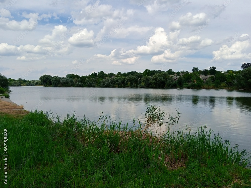 Summer landscape, clouds over the lake Summer landscape, clouds over the lake