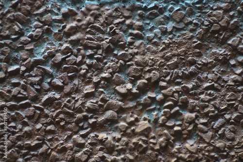 Still-life. Photo of the wall surface with streaks and clumps of plaster. In Dark Reds and bright Blues.