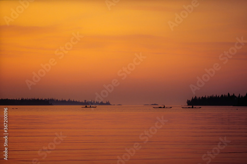 Canoes on a Lake in Southern Sweden at Sunset