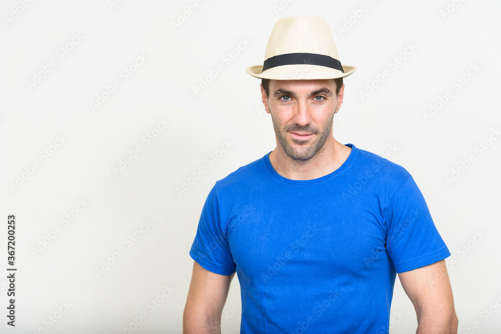 Portrait of handsome Hispanic tourist man ready for vacation