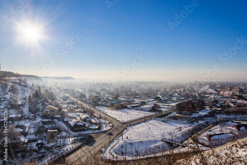 Tobolsk in winter. View of the lower town on a sunny winter morning. Light haze from wood stove heating. Tobolsk is a city in Western Siberia, Russia.