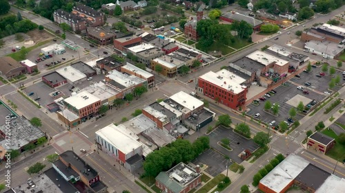 Scenic aerial flyover of a small town America on a quiet morning  with empty streets 01