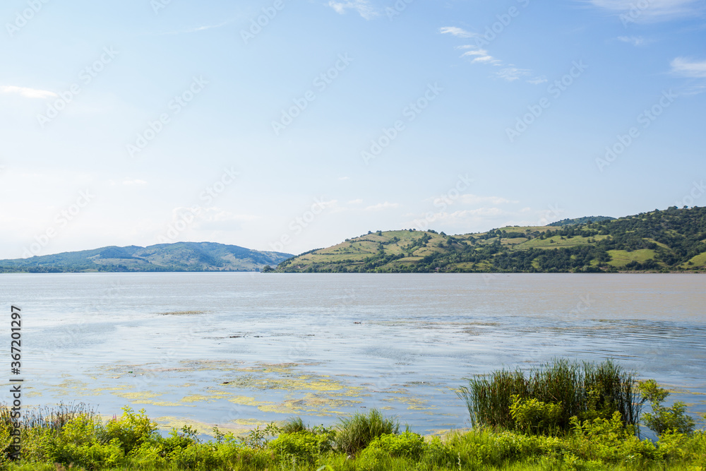 Beautiful river landscape on summer day with blue sky Beautiful river landscape on summer day with blue sky