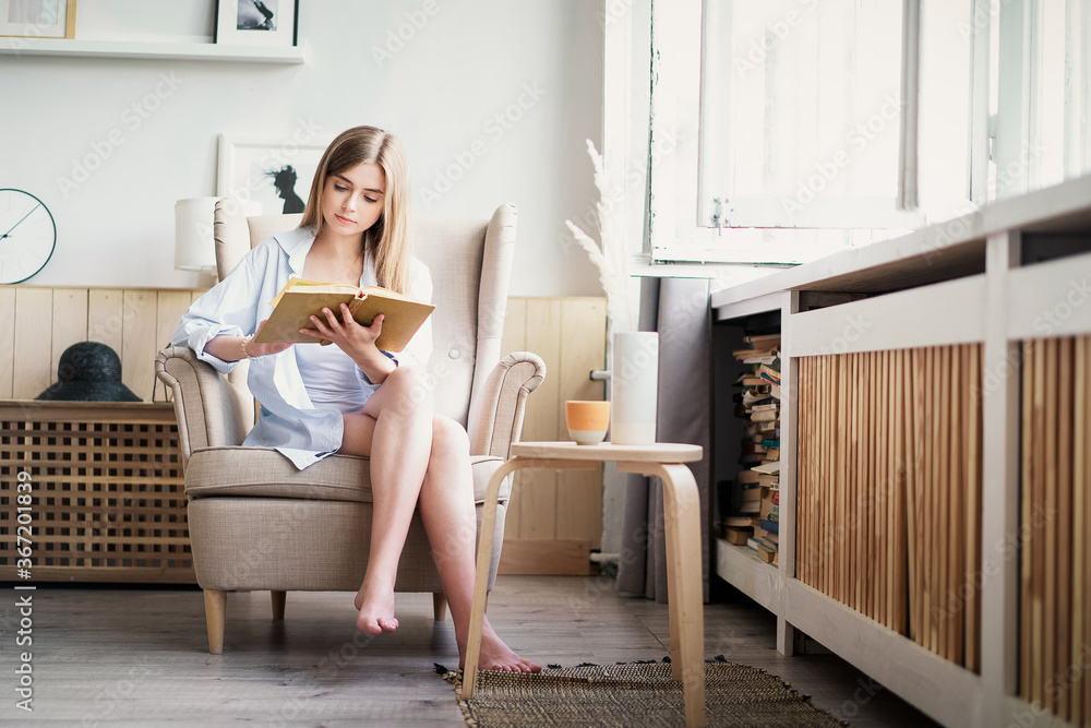 Woman reading a novel relax at home. Quarantine Indoor lifestyle. Leisure indoors entertainment. Woman reading a novel relax at home. Quarantine Indoor lifestyle. Leisure indoors entertainment.