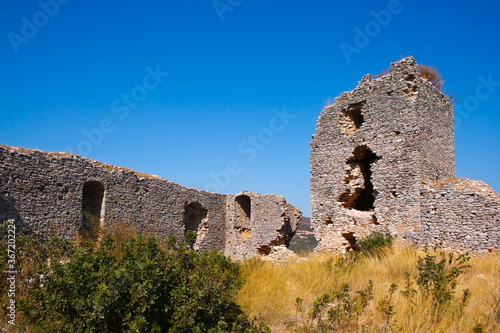 The famous castle of Mila in Messinia in Greece against a blue sky photo