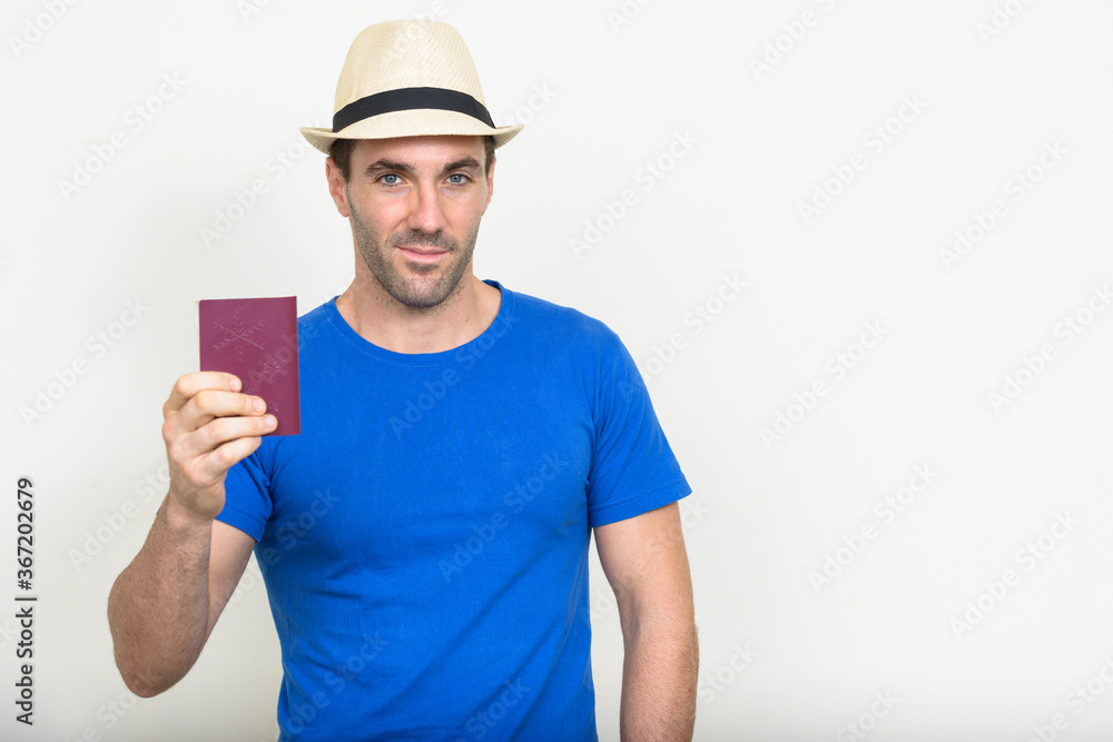 Portrait of handsome Hispanic tourist man ready for vacation Portrait of handsome Hispanic tourist man ready for vacation