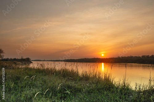 Beautiful sunset on the banks of a large river