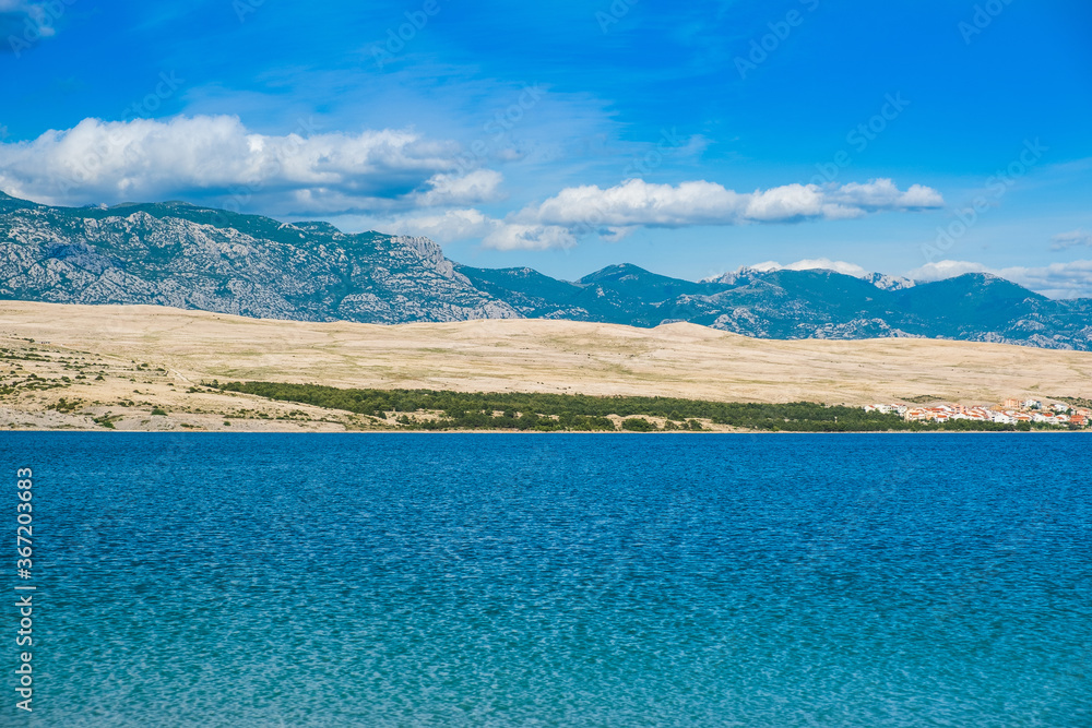 Island of Pag on Adriatic sea in Croatia Velebit mountain in background