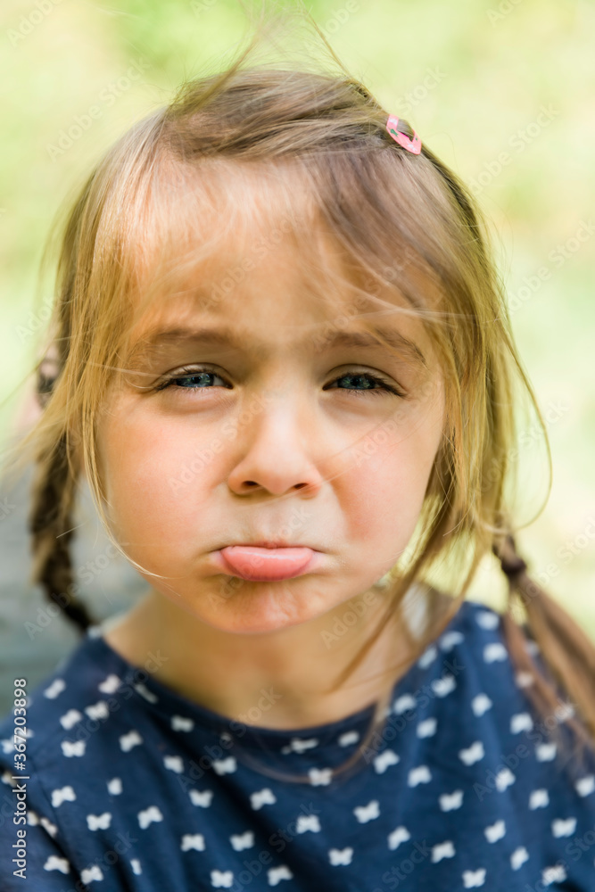 Girl with braided hair sulking Girl with braided hair sulking