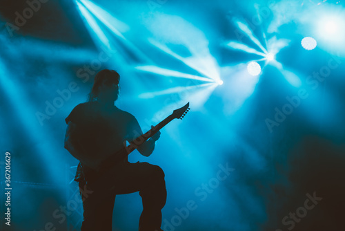 Fototapeta Naklejka Na Ścianę i Meble -  Guitarist silhouette. Silhouette of man with electric guitar.