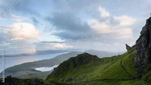 Rainbow by the Old Man of Storr. Hiking in the Quairing Mountains on the Isle of Skye in Scotland