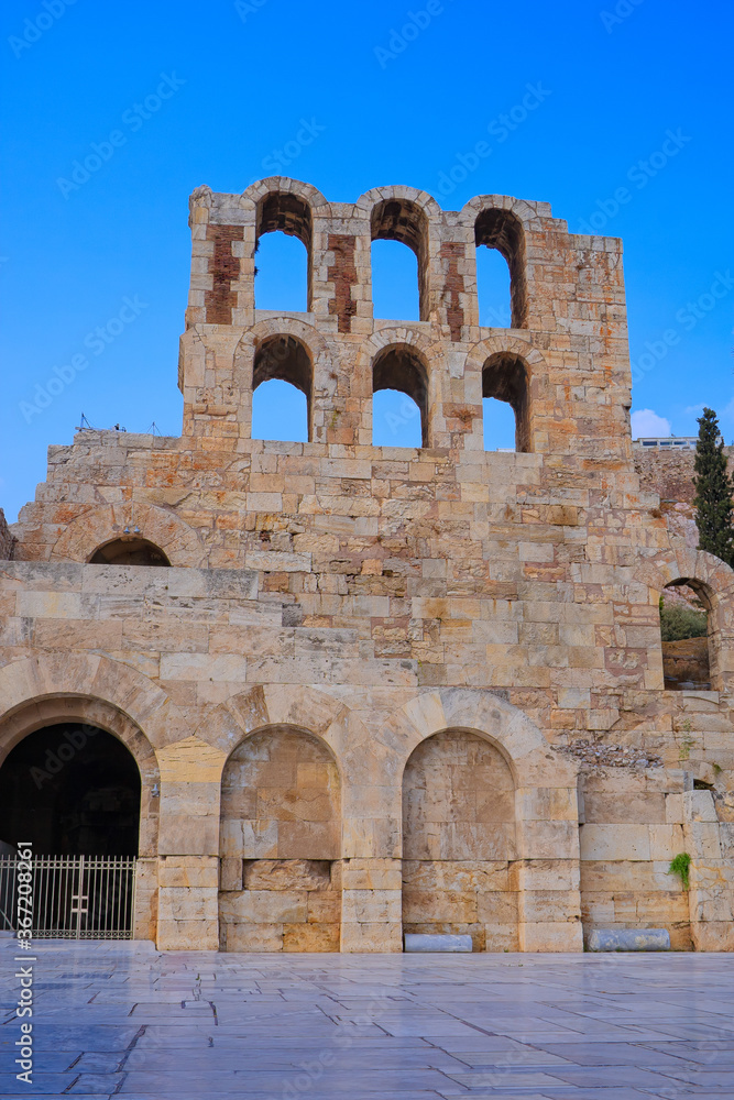 Odeon of Herodes Atticus in Athens Greece against a blue sky