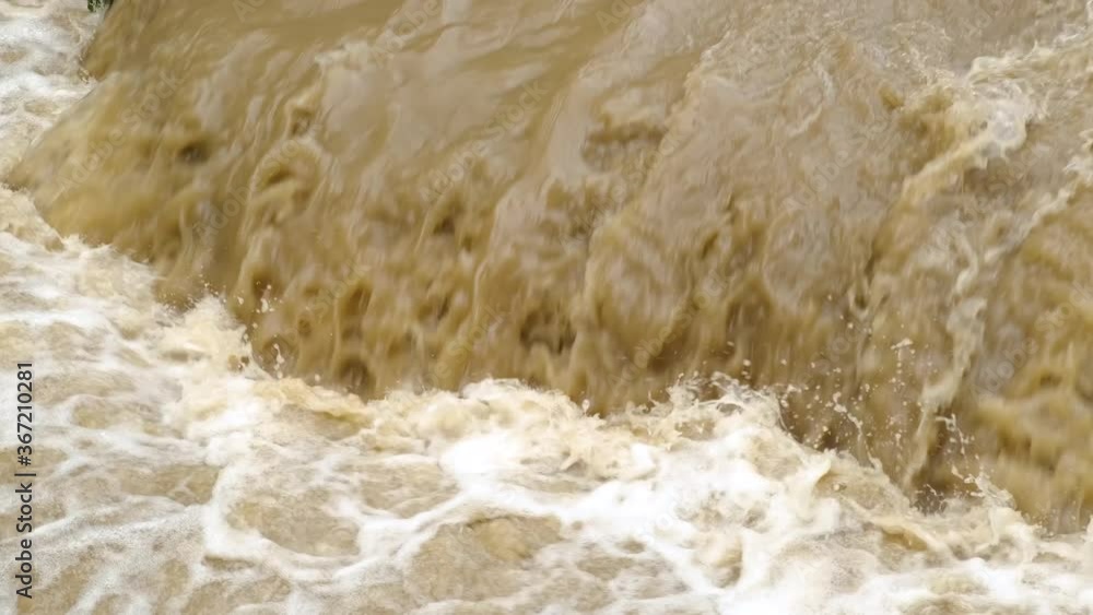 Dirty water of muddy river in flooding period during heavy rains in spring. Dirty water of muddy river in flooding period during heavy rains in spring.