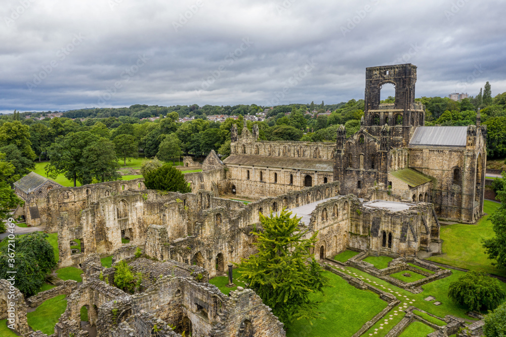 Obraz premium Kirkstall Abbey in Leeds, Yorkshire England. Old ruined architecture of the abbey and grounds close to Leeds city centre in West Yorkshire.