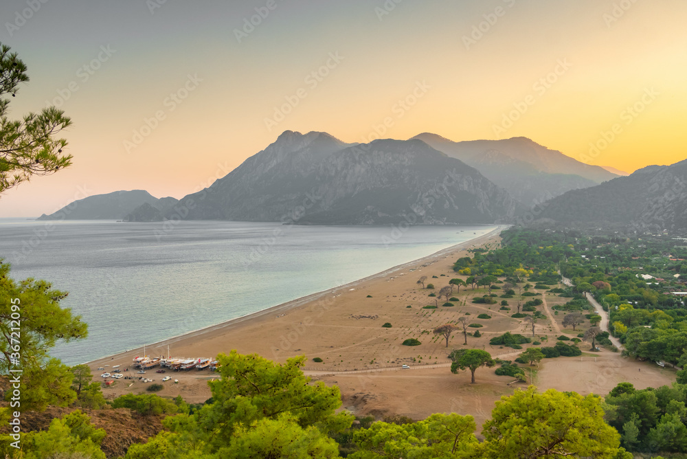 Fototapeta premium Beautiful sunset view of the Cirali Olympos beach at Mediterranean sea, Antalya, Turkey