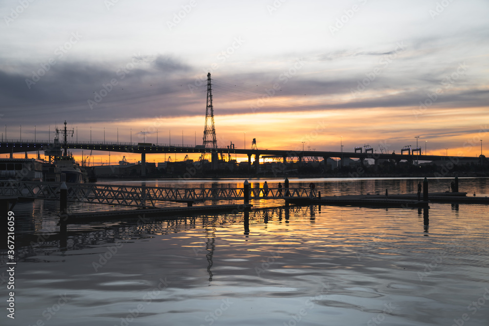 Bridge and industry at sunset