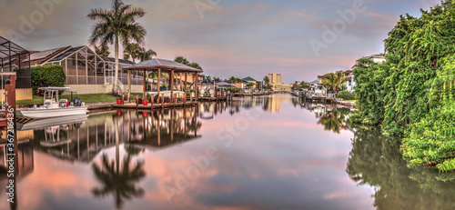 Sunrise over a Waterway leading to the Ocean near Vanderbilt Beach in Naples photo