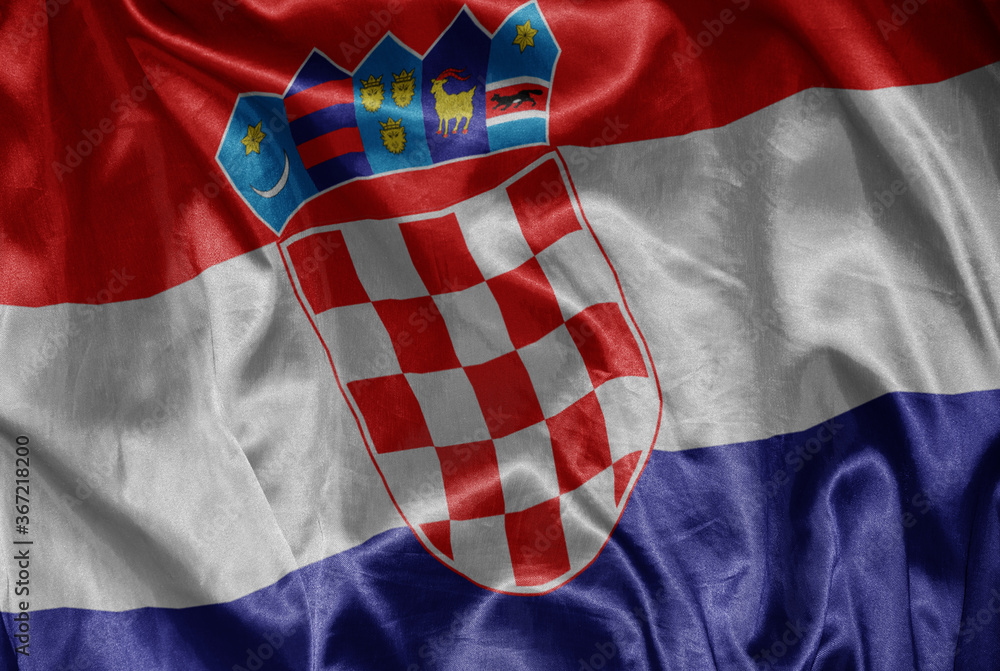 Obraz premium colorful shining big national flag of croatia on a silky texture.