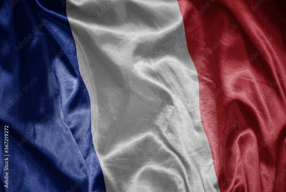 colorful shining big national flag of france on a silky texture.