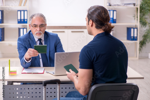 Young man visiting embassy for visa application