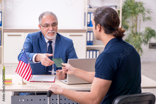 Young man visiting embassy for visa application