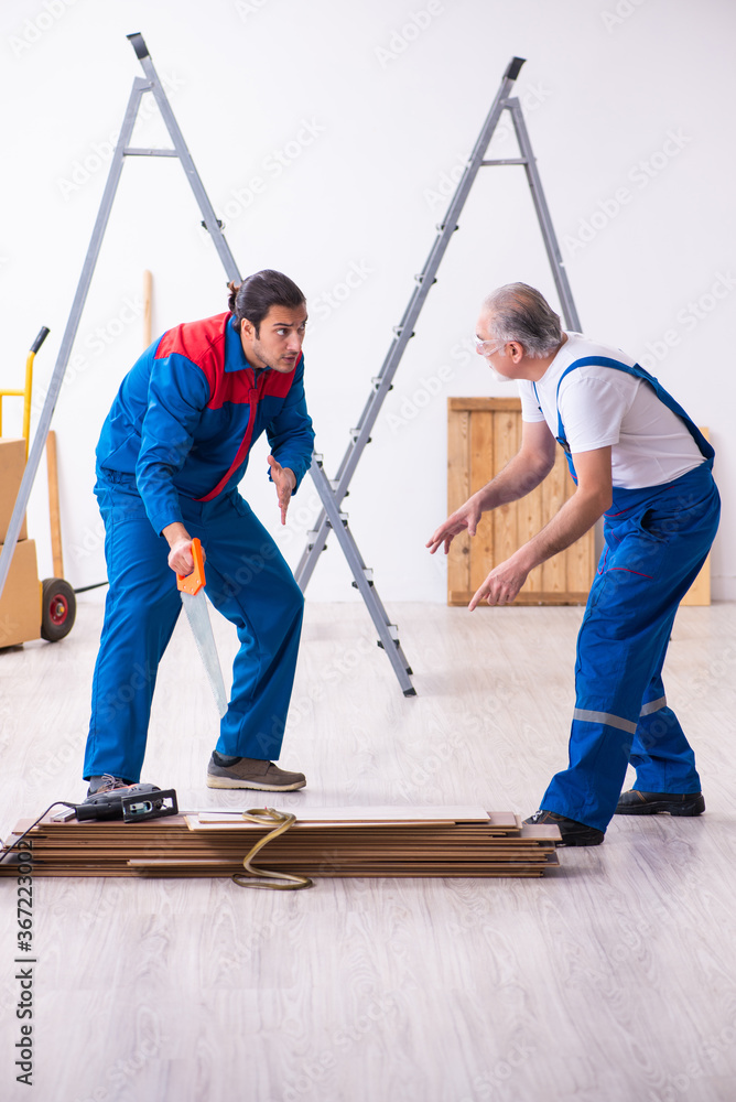 Two contractors and snake indoors Two contractors and snake indoors