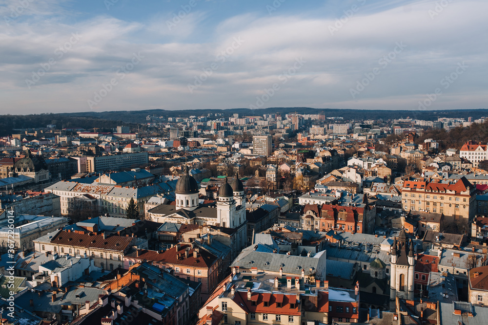 View of the old city from above, from the observation tower of the town hall. Lviv, Ukraine, winter panorama. Aerial view.