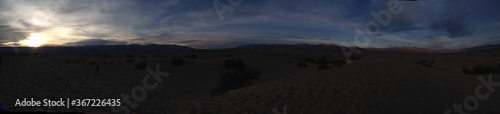 Panaromic View of Death Valley National Park Sand Dunes Beneath Cloudy Sky at Dusk