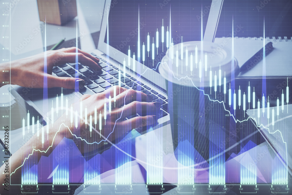 Double exposure of woman hands typing on computer and forex chart hologram drawing. Stock market invest concept.