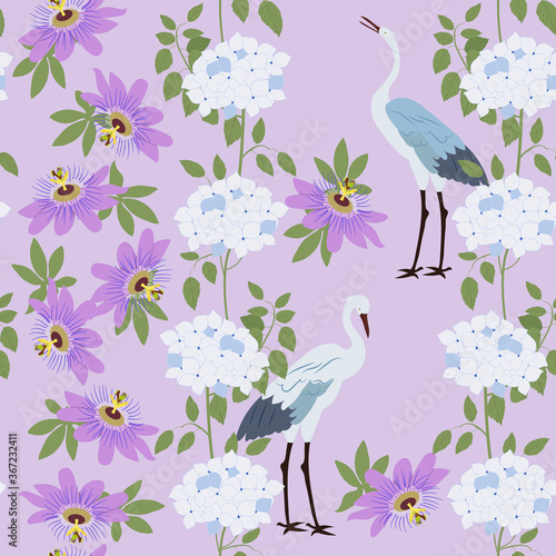 Seamless vector illustration with tropical flowers Passiflora, hydrangea and birds.