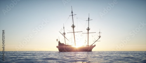 Fotografia Sailing vessel sailing in the ocean with sunset.
