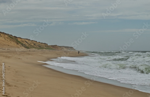 A lone Fisherman on the beach in Cape Cod
