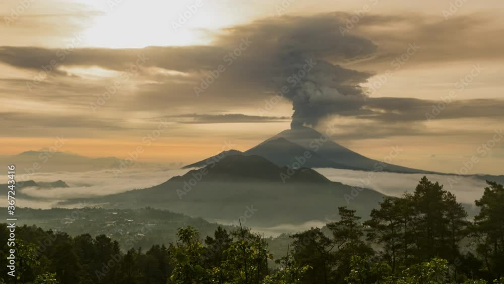 Timelapse of the eruption volcano Agung in Bali with beautiful views of the nature and volcano Batur and Abang. Big smoke and ash cover the sky. sunrise time in kintamani. unesco Timelapse of the eruption volcano Agung in Bali with beautiful views of the nature and volcano Batur and Abang. Big smoke and ash cover the sky. sunrise time in kintamani. unesco