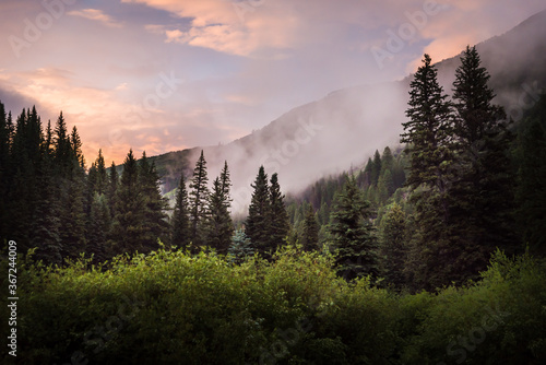 Photography Cloudy Colorado mountain scenery during sunset.