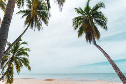 Tropical nature clean beach and white sand in summer with sun light blue sky and bokeh background.