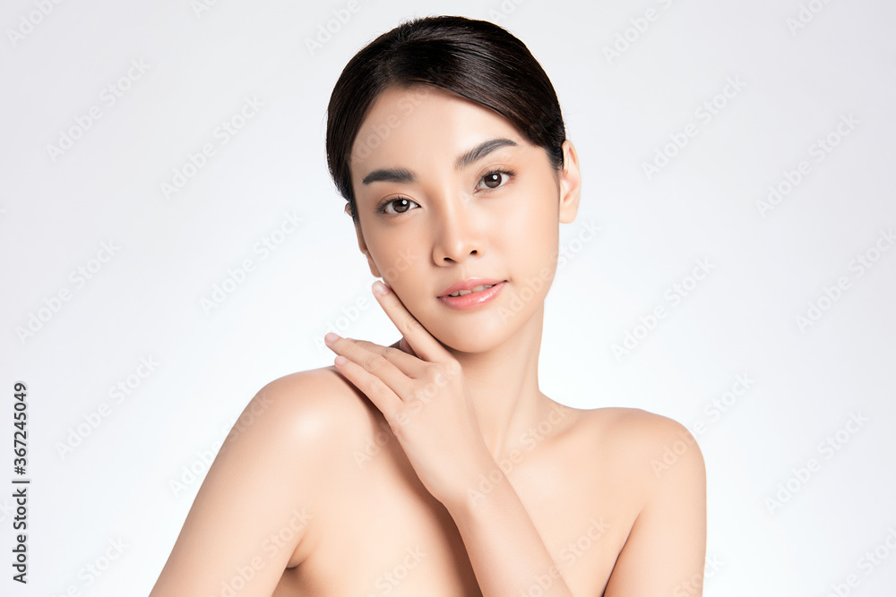 Beautiful Young asian Woman with Clean Fresh Skin, on white background, Face care, Facial treatment, Cosmetology, beauty and spa, Asian women portrait Beautiful Young asian Woman with Clean Fresh Skin, on white background, Face care, Facial treatment, Cosmetology, beauty and spa, Asian women portrait