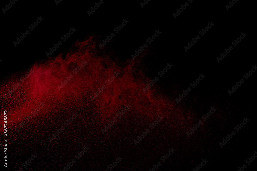 Red powder explosion on black background. Red powder explosion on black background.