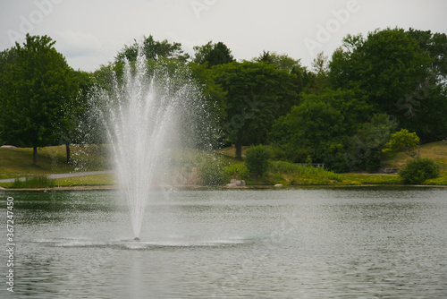 A water fountain in the middle of a lake