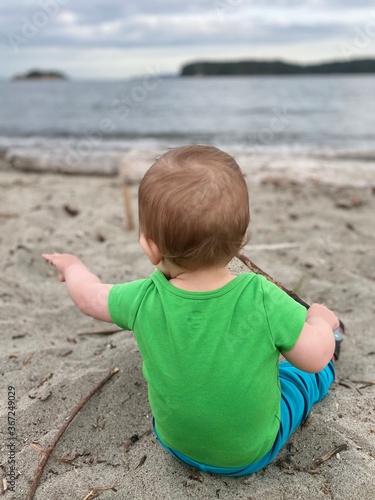 little boy playing on the beach