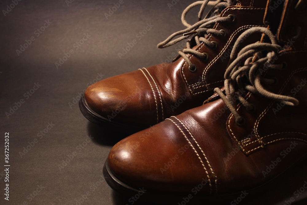brown leather boots on a dark background